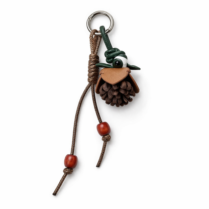 Breloque de sac à main avec pompon fleuri pour femme, porte-clés haut de gamme en cuir PU, pendentif en corde tressée avec pomme de pin et fleur.