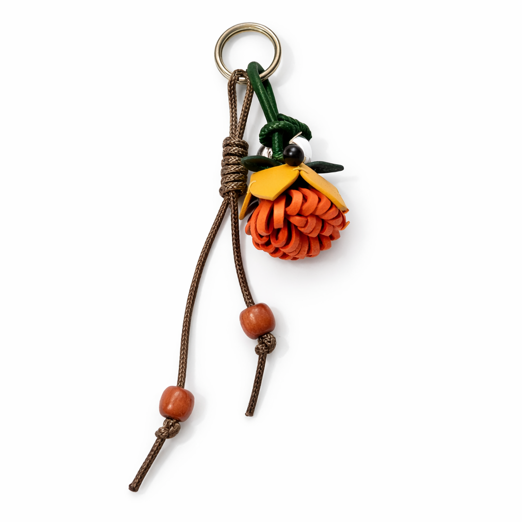 Breloque de sac à main avec pompon fleuri pour femme, porte-clés haut de gamme en cuir PU, pendentif en corde tressée avec pomme de pin et fleur.