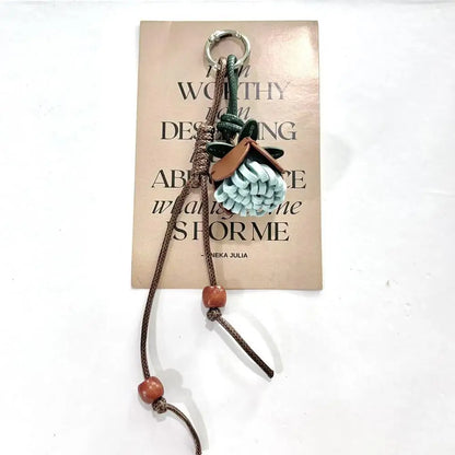 Breloque de sac à main avec pompon fleuri pour femme, porte-clés haut de gamme en cuir PU, pendentif en corde tressée avec pomme de pin et fleur.